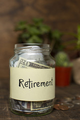Jar filled with money and retirement label
