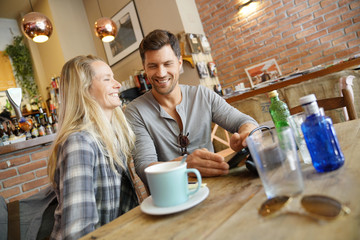 Middle-aged couple sitting at coffee shop