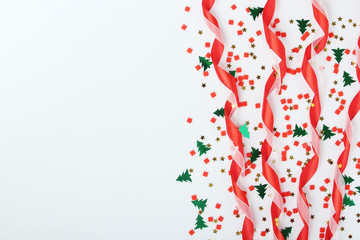 Red ribbon and confetti New year background with copy space	