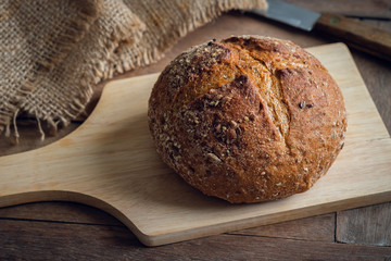 Bread loaf on wooden board