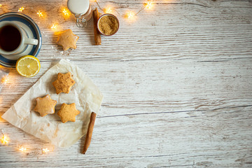 Christmas snack with tea and star-shaped cakes, with space on the right