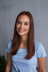 Fototapeta premium Beautiful young woman face closeup, brown hair