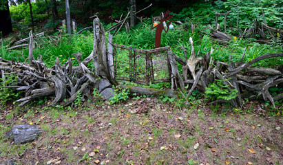 Driftwood fence and gate surrounding garden