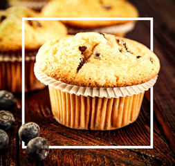 Fresh mufins on desk and free space for your decoration. 