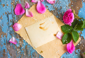 Festive flower composition on the blue shabby wooden background. Overhead view. card of the last...