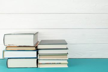Front view piles of books with copy space