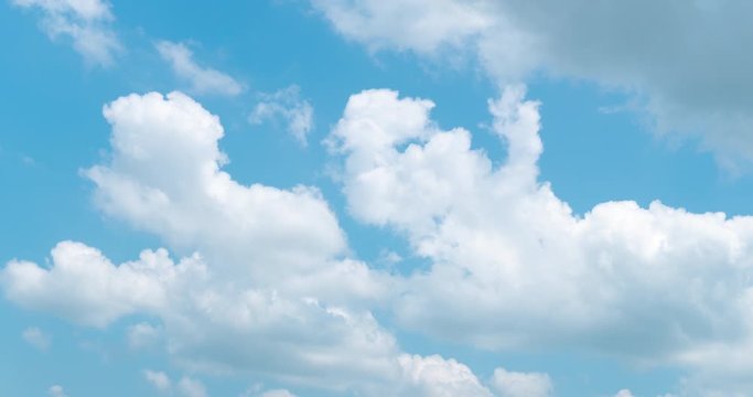 time lapse of cumulus clouds with bright blue sky