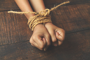 Hands tied by strong rope
