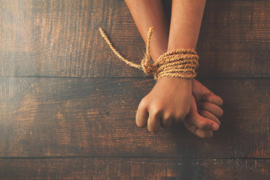 Hands tied by strong rope