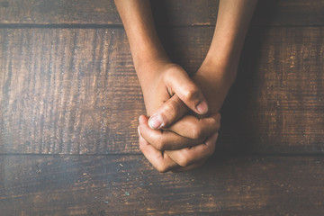 Emotional young boy hand holding together