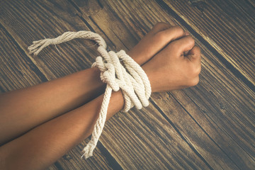 Hands tied by strong rope