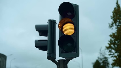 Funny and conceptual traffic light on road crossing in Akureyri, Iceland changes from green to red. The stop signal in shape of heart. Concept relationship and love