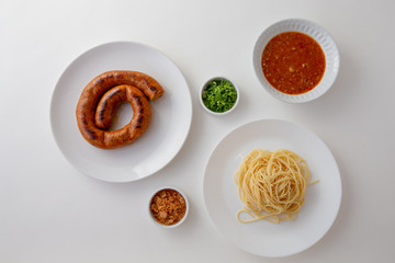 Spicy Spaghetti with Thai sausage isolaed whie Background.