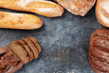 Freshly bread on gray kitchen table. Top view.