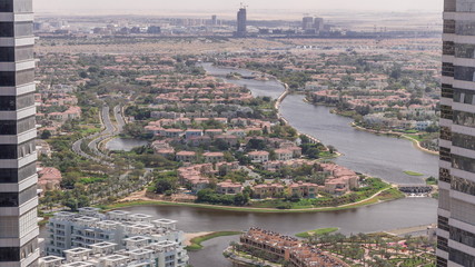 Aerial view of apartment houses and villas in Dubai city timelapse, United Arab Emirates