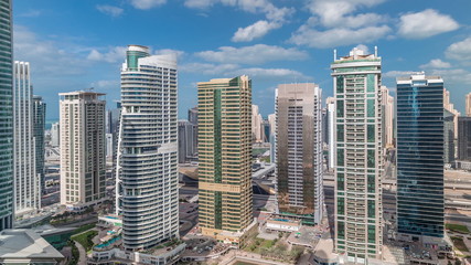 Fototapeta premium Residential apartments and offices in Jumeirah lake towers district timelapse in Dubai