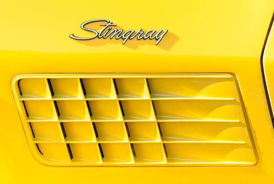 Vehicle badge closeup of an American Corvette Stingray muscle car in Rushmoor, UK - March 25, 2016