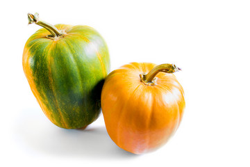 Two pumpkins isolated on a white background
