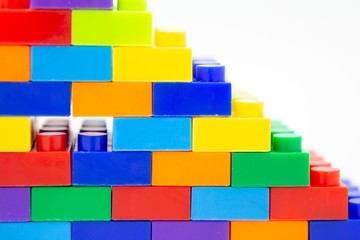 brick blocks stairs toy mini figures colorful on white background . building plastic fun collection for child .