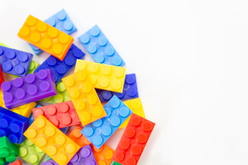 top view brick blocks toy mini figures colorful on white background . plastic fun collection for child with copy space for text .