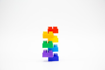 brick blocks tower cubes toy mini figures colorful on white background . building plastic fun collection for child . infographic geometric template concept with white copy space.