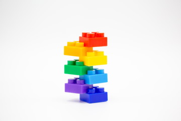 brick blocks tower cubes toy mini figures colorful on white background . building plastic fun collection for child . infographic geometric template concept with white copy space.