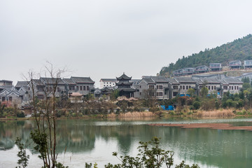 Fototapeta na wymiar Ming Qing Dynasty Chinese traditional rural house at the lakeside, in Qingyan Ancient town, one of famous old town and popular travel destination in Guiyang, Guizhou Province, China.