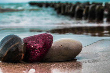 Plakat Zen stones on the beach with sand and sea view