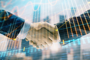 Double exposure of financial graph on cityscape background with two businessman handshake. Concept of stock market deal