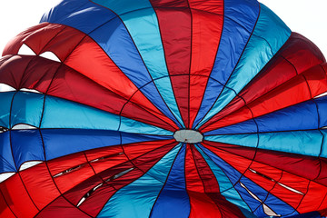 flying Water parachute umbrella on the sky background.
