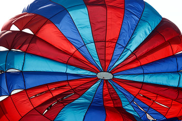 Fototapeta premium flying Water parachute umbrella on the sky background.