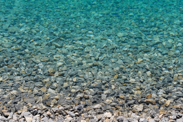 Stones in the clear water of a mountain lake