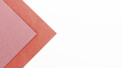 Fototapeta premium Pink triangular cardboard sheets with copy space