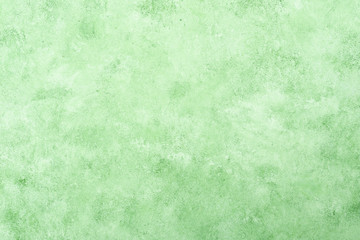 Fresh green textured stucco wall background