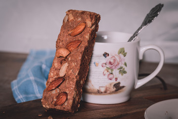 Tasty chocolate chip whey protein bar with almond and cashew nut on top