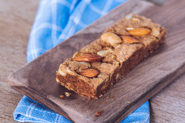 Tasty chocolate chip whey protein bar with almond and cashew nut on top
