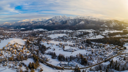 Aerial landscape with tatra mountains and Zakopane, winter scenery of Giewont Peak.