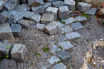 unfinished paving stones walkway, construction site and gray Paving on a walking path