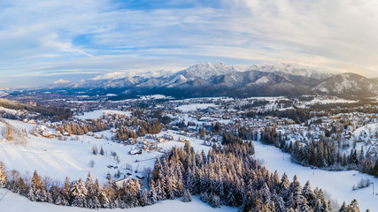 Aerial landscape with tatra mountains and Zakopane, winter scenery of Giewont Peak.
