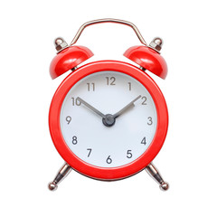 Red retro alarm clock isolated on white background