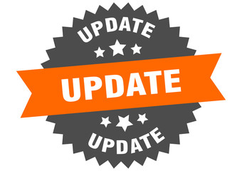 update sign. update orange-black circular band label