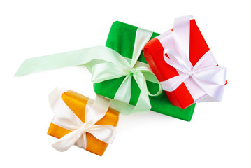 Three beautiful wrapped gifts isolated on white background