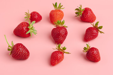 Strawberries on pink background. Fresh organic food concept