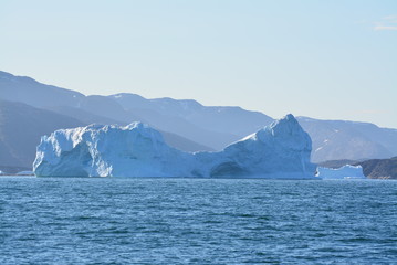 Fototapeta na wymiar Titel: Disko Bay, Greenland - July - boat trip in the morning over the arctic sea - cold and fresh air and big beautiful icebergs, quiet moments in a wonderful nature