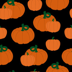 Vector seamless pattern of pumpkins on black background.