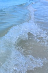 Obraz premium Close up of an ocean wave on beach