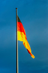 Germany flag black red gold blowing on the flagpole