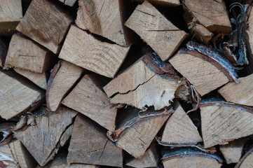 stacked pile of firewood for fireplace and stove