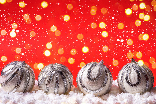 Festive christmas background with glitting confetti and balls.