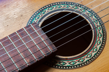 six strings on an old worn guitar